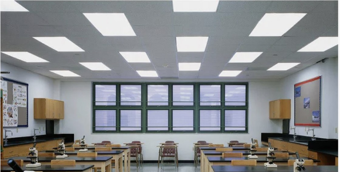 CGFP series 2' x 4' LED flat panels installed in a bright classroom ceiling