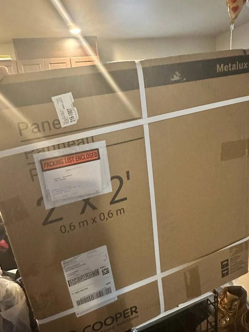 Strapped 2' x 2' LED flat panel carton with packing list and shipping labels