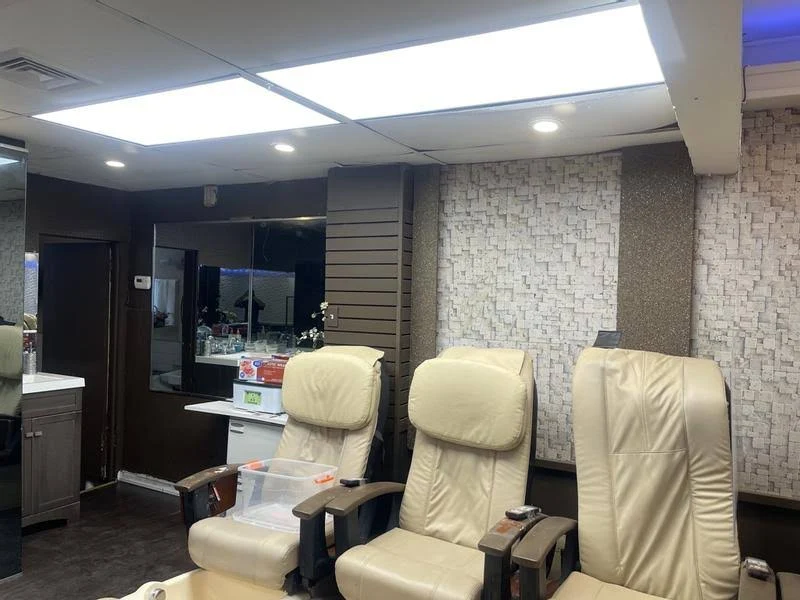 Installed 2' x 2' LED flat panels lighting a finished commercial interior